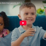young girl and boy engaging with a videographer answering questions about what their parents jobs are