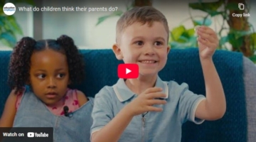 young girl and boy engaging with a videographer answering questions about what their parents jobs are
