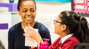 Volunteer with primary school pupil